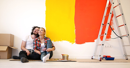 Image showing Happy young couple relaxing after painting