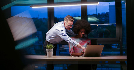 Image showing Multiethnic startup business team in night office