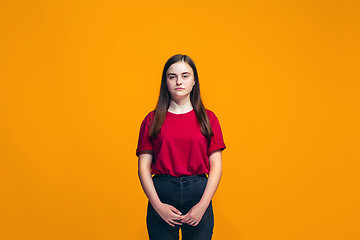 Image showing Young serious thoughtful teen girl. Doubt concept.