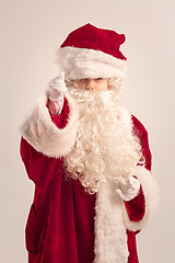 Image showing The happy girl in santa claus costume at studio