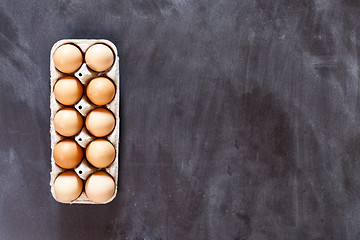 Image showing Ten chicken eggs in cardboard container.