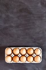 Image showing Farm chicken eggs in cardboard container.