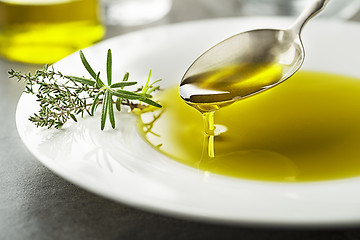 Image showing Olive oil pouring