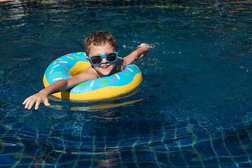 Image showing One little happy boy  playing on the inflatable circle