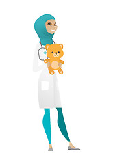 Image showing Pediatrician doctor holding teddy bear.