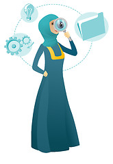 Image showing Muslim business woman with magnifying glass.