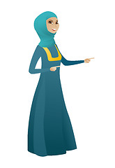 Image showing Muslim business woman pointing to the side.