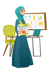 Image showing Muslim business woman holding pile of folders.