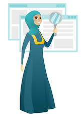 Image showing Muslim business woman with magnifying glass.