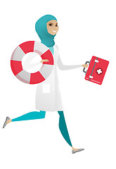 Image showing Paramedic running with first aid box and lifebuoy.