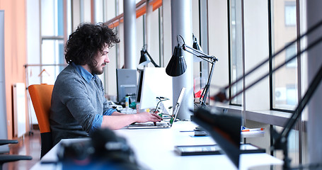 Image showing businessman working using a laptop in startup office