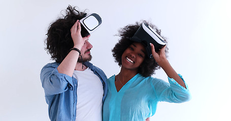 Image showing multiethnic couple getting experience using VR headset glasses