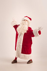 Image showing The happy girl in santa claus costume at studio