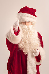 Image showing The happy girl in santa claus costume at studio