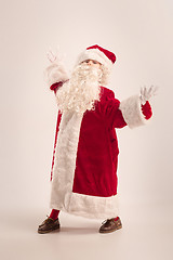 Image showing The happy girl in santa claus costume at studio