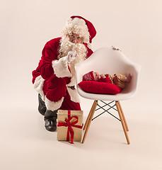 Image showing Christmas portrait of cute little newborn baby girl, dressed in christmas clothes, studio shot, winter time