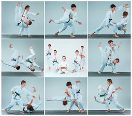 Image showing The group of boys and girl fighting at Aikido training in martial arts school. Healthy lifestyle and sports concept