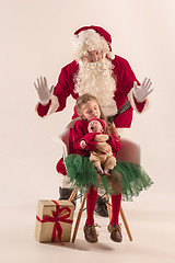 Image showing Christmas portrait of cute little newborn baby girl, dressed in christmas clothes, studio shot, winter time