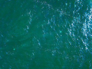 Image showing Areal view of pure turquoise ocean water in a summer day. Natural background with space for text.