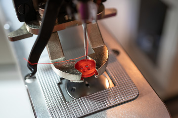 Image showing Fastening sewing machine close-up. Modern textile industry.