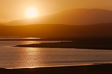 Image showing Sunset with Lake and Hilly Landscape