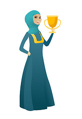 Image showing Muslim business woman holding a trophy.