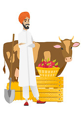 Image showing Farmer standing with crossed arms near cow.