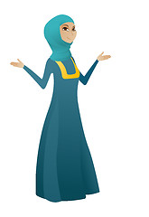 Image showing Muslim confused business woman with spread arms.