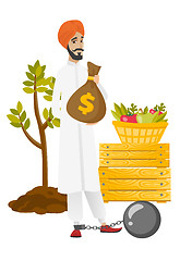 Image showing Chained hindu farmer holding a money bag.