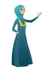 Image showing Muslim business woman showing a direction.