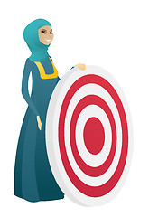 Image showing Young muslim business woman and dart board.