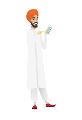 Image showing Hindu businessman holding a mobile phone.