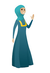 Image showing Young muslim business woman waving her hand.