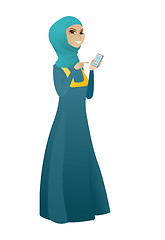 Image showing Muslim business woman holding a mobile phone.