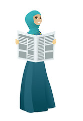 Image showing Muslim business woman reading newspaper.
