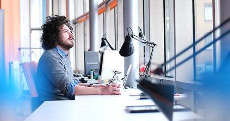 Image showing businessman working using a laptop in startup office