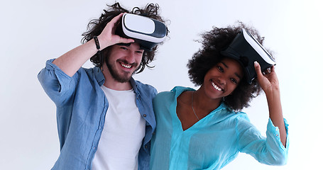 Image showing multiethnic couple getting experience using VR headset glasses