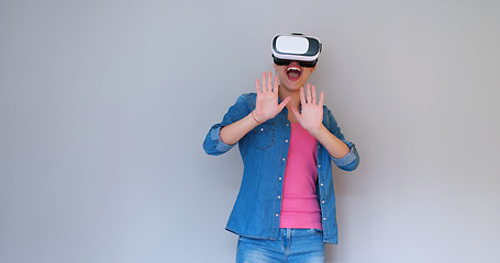 Image showing girl using VR headset glasses of virtual reality