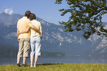 Image showing Couple arm in arm at a mountain lake