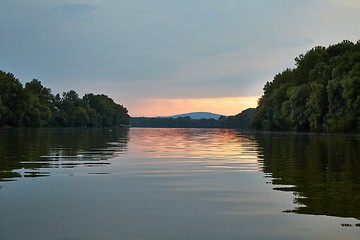 Image showing Peaceful waters of a river at sunset