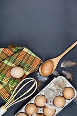 Image showing Eggs, kitchen utensil and feathes.