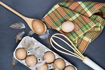 Image showing Eggs and feathes on backboard background.