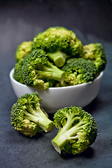 Image showing Fresh green organic broccoli in white bowl.