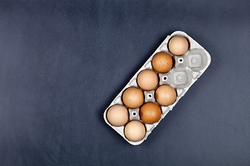 Image showing Farm chicken eggs in cardboard container