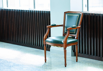 Image showing chair with a leather green seat, back, and armrests