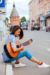 Image showing beautiful european woman with guitar