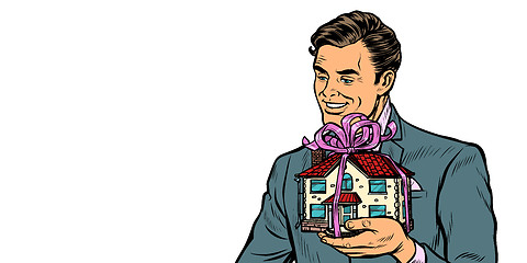 Image showing Businessman selling real estate, house as a gift isolate on white background