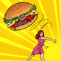 Image showing Woman throws Burger, fast food. Diet and healthy eating