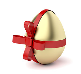 Image showing Gold egg with red ribbon