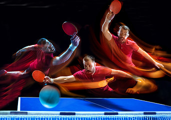 Image showing The table tennis player serving